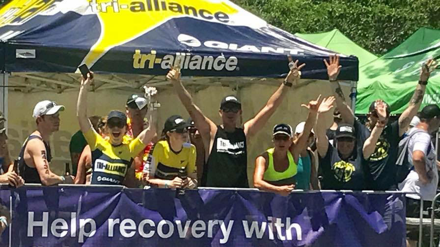 The Tri Alliance cheer squad supporting athletes at Noosa