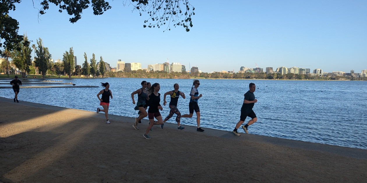 Tri Alliance runners completing a time trial beside Albert Park Lake
