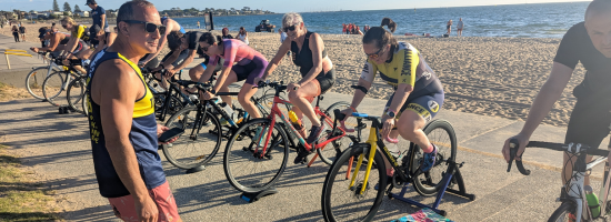 A Tri Alliance coach guiding athletes through a combo training session at Elwood