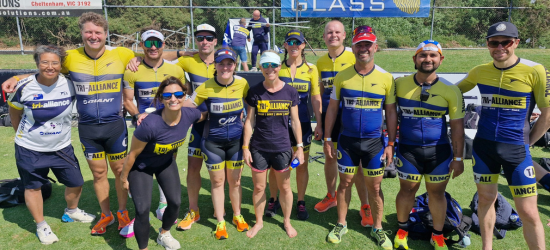 Tri Alliance squad together in club kit at a race